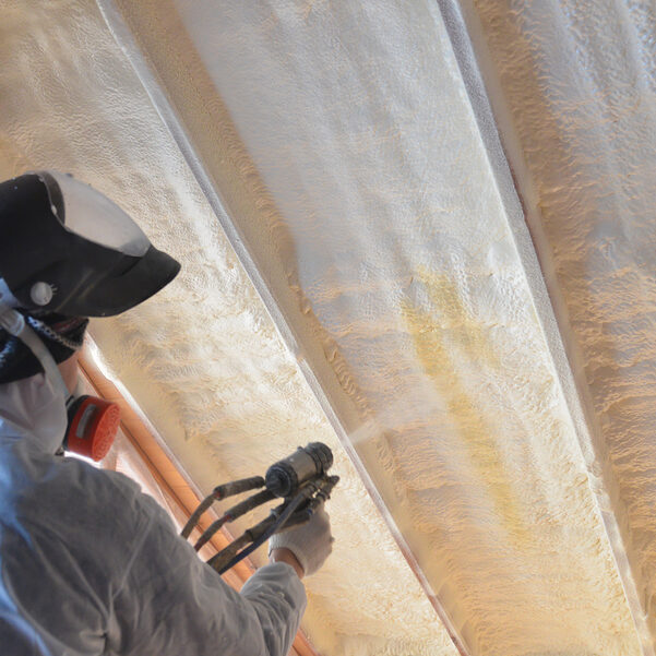 a man spraying warming foam